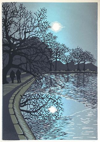 Two figures are walking next to an ice covered pond surrounded by trees.